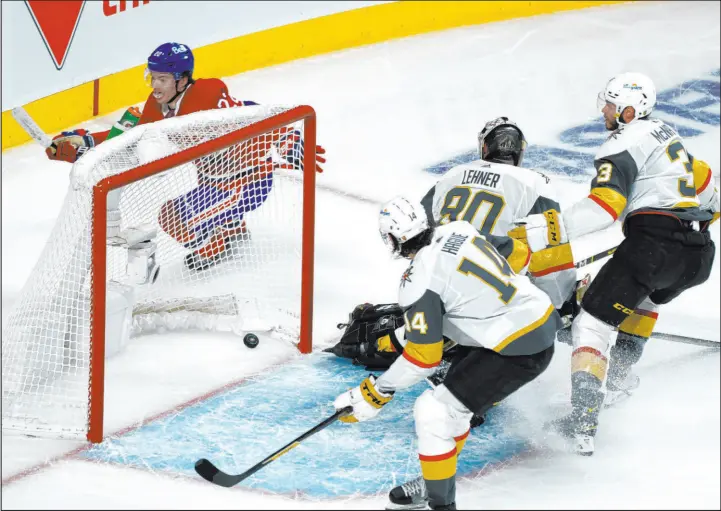  ?? Paul Chiasson The Canadian Press via AP ?? Cole Caufield finishes neatly for his second-period goal in Game 6 as Knights goaltender Robin Lehner and teammates Nicolas Hague and Brayden Mcnabb fail to defend.