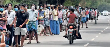  ??  ?? AT MAPPEDU
in Tiruvallur district, Tamil Nadu, on May 7 at a retail liquor outlet.