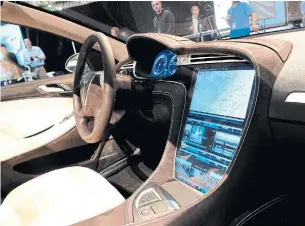  ?? ROBYN BECK AFP VIA GETTY IMAGES ?? Cars can collect informatio­n about where we go, our driving habits and even use sensors to track eye movements — all informatio­n, that can be useful to those who know how to use it.