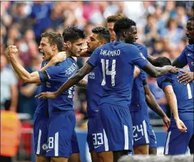  ?? DAN ISTITENE / GETTY IMAGES ?? Alvaro Morata of Chelsea celebrates scoring a goal with teammates during the Emirates FA Cup on April 22 in London.