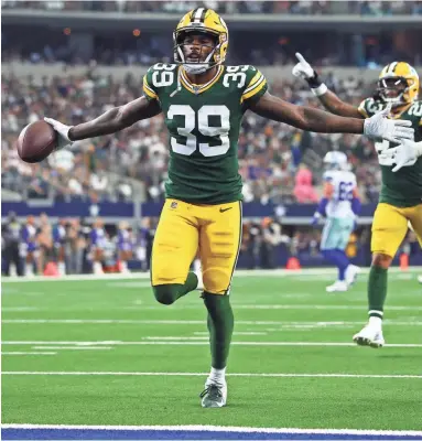  ?? MATTHEW EMMONS / USA TODAY SPORTS ?? Green Bay Packers cornerback Chandon Sullivan celebrates a second-quarter intercepti­on against the Dallas Cowboys at AT&T Stadium on Sunday.