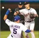  ??  ?? San Francisco Giants second baseman Joe Panik throws to first after forcing out Albert Almora Jr. at second during Wednesday’s game in Chicago.