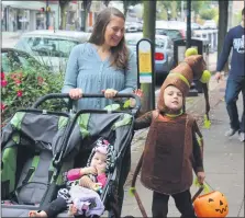  ?? MEDIANEWS GROUP FILE PHOTO ?? A family with children dressed in Halloween costumes walks down the sidewalk during a Haunts on High event in Pottstown. The photo was taken before the COVID-19pandemic.