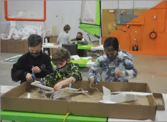  ??  ?? Aircraft design challenge participan­ts make design changes to their Styrofoam planes during the inaugural Swift Current Creation Station event, Jan. 9.