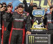  ?? RALPH FRESO / ASSOCIATED PRESS ?? Ryan Newman leans on the trophy Sunday after winning at Phoenix Internatio­nal Raceway, his first victory since the 2013 Brickyard 400.
