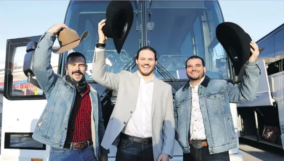 ?? DARREN MAKOWICHUK ?? Stampeders Eric Mezzalira, Alex Singleton and Rene Paredes wave as they leave McMahon Stadium Tuesday to travel to Edmonton for the 106th Grey Cup.