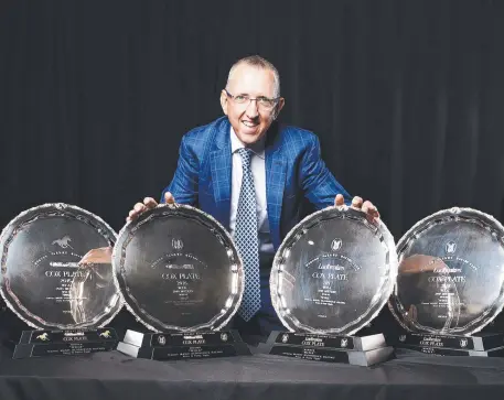  ?? Picture: ZAK SIMMONDS ?? DREAM RUN: Winx co-owner Peter Tighe with Winx's four Cox Plates at the Carbine Club lunch at Elwick.