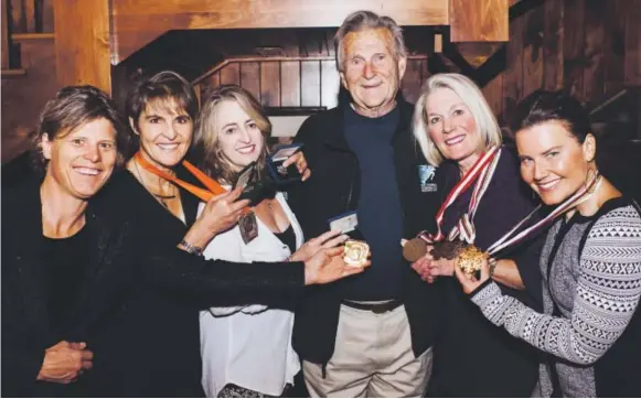  ??  ?? From left, former U.S. Ski Team athletes Debbie Armstrong, Christin Cooper, Tamara McKinney, Cindy Nelson and Eva Twardokens with their Olympic and world championsh­ips medals pose with Dr. Richard Steadman at a celebratio­n in his honor last weekend in...