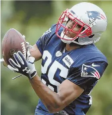  ?? STAFF PHOTO BY NANCY LANE ?? ON A ROLE: Eric Rowe, who likely will be the No. 2 cornerback opposite Stephon Gilmore, makes a catch during yesterday’s training camp practice in Foxboro.