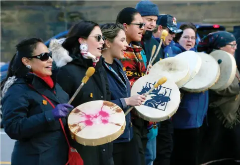  ?? TONY CALDWELL ?? Participan­ts in the Moose Hide Campaign, a grassroots movement centred on men and boys working to end violence against women and children, wear symbolic moosehide patches during their third annual National Gathering and Day of Fasting on Parliament Hill on Thursday.