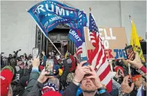  ?? JOHN MINCHILLO THE ASSOCIATED PRESS FILE PHOTO ?? Donald Trump supporters gather outside the Capitol in Washington. Lawmakers in the United States are hearing chilling warnings about the growing threat of domestic extremism after last month's riots on Capitol Hill.