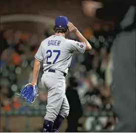 ?? D. Ross Cameron Associated Press ?? BAUER GESTURES to the Giants crowd during one of his best games on May 21. Five weeks later, a temporary restrainin­g order was obtained by his accuser.