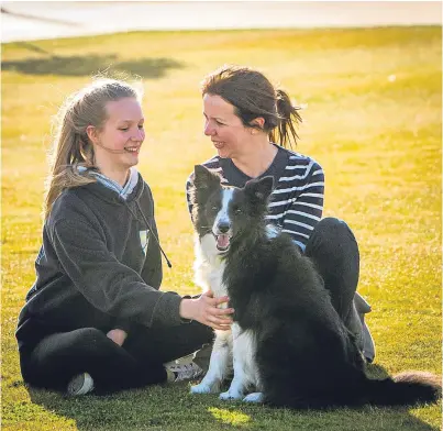  ??  ?? Picture: Steve MacDougall. Enjoying the continuing glorious weather in Dundee’s newest green space, Slessor Gardens at the waterfront, yesterday were Nicky McBean and daughter Matilda with their dog Ginny.