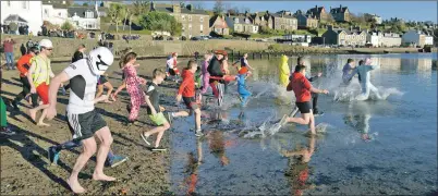  ?? 25_c01dip06 ?? Swimmers take to the water earlier this year.