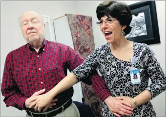  ?? Mcclatchy News ?? Dr. Ellen Markus, right, speech language pathologis­t with the University of North Carolina Voice Center, teaches speaking techniques to Ray Carpenter, 85, of Chapel Hill, N.C., during a March vocal therapy session.