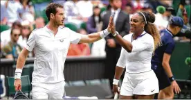  ?? MATTHIAS HANGST / GETTY IMAGES ?? Andy Murray and Serena Williams celebrate during their first round mixed-doubles win Saturday over Andreas Mies and Alexa Guarachi Saturday at Wimbledon in London. Williams also won a singles match Saturday.