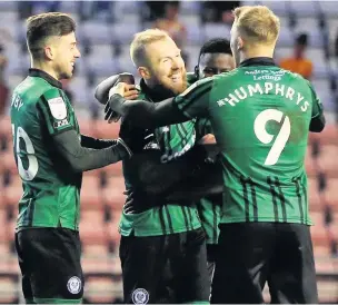  ?? Lewis Storey ?? ●●Stephen Dooley celebrates after scoring Dale’s third goal at Wigan