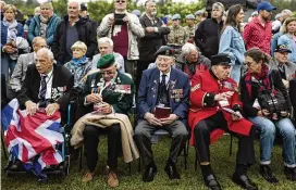  ?? JEREMIAS GONZALEZ / AP ?? British Veterans attend a ceremony at Pegasus Bridge, in Ranville, Normandy, Sunday. Today, the Normandy American Cemetery and Memorial will host U.S. veterans and thousands of visitors in its first major public ceremony since 2019.