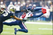  ??  ?? Houston Texans wide receiver DeAndre Hopkins (10) tries to pull in a pass against New Orleans Saints cornerback Marshon Lattimore (23) in the first
half of an NFL football game in New Orleans on Sept 9. (AP)