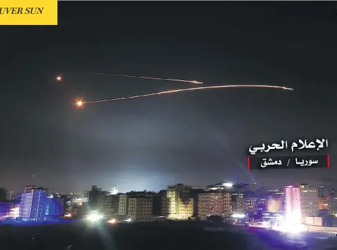 ?? STR / AFP / CENTRAL WAR MEDIA / GETTY IMAGES ?? Syrian air defence systems intercept Israeli missiles over Damascus in images released by the Syrian government-affiliated Central War Media. Israel’s army said it launched raids overnight against Iranian targets in Syria after its forces were...