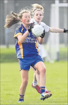  ??  ?? Wicklow's Orlaith Whelan reaches the ball ahead of Kildare's Niamh Mulhall during the Ladies leinster MFC semi-final in Aughrim.
