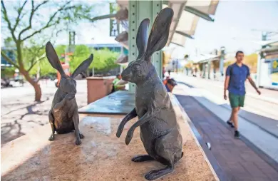  ?? MICHAEL CHOW/THE REPUBLIC ?? One of 18 bronze sculptures by artist Tad Savinar that adorn the light rail station at the Tempe Transit Center on Wednesday.