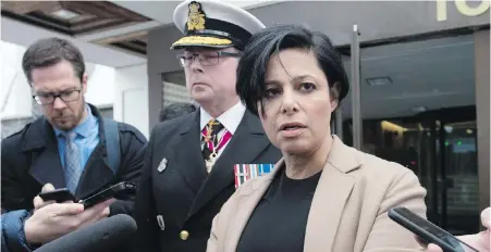 ?? JUSTIN TANG, CP ?? Vice-Admiral Mark Norman and his lawyer, Marie Henein, speak to reporters Tuesday on their way out of court.