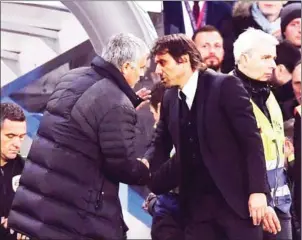  ?? AFP ?? Chelsea head coach Antonio Conte (right) shakes hands with Manchester United manager Jose Mourinho after their English Premier League match on October 23, 2016.