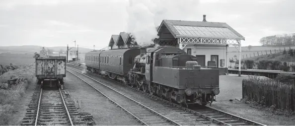  ?? A Linaker/Kiddermins­ter Railway Museum ?? Tillynaugh­t was the junction station establishe­d by the Banff, Portsoy & Strathisla Railway upon its 30 July 1859 opening from the GNSR main line station of Grange, 4¼ miles to the Aberdeen side of Keith Junction, to both Banff and Portsoy. From humble beginnings, this impressive station was provided once the Portsoy line evolved into the Moray Coast route through to Elgin, this view being of the connecting Tillynaugh­t to Banff branch service on 26 May 1961. Departing tender-first with its two-coach train is BR Standard ‘2MT’ Mogul No 78045, the third and last member of its class to join the Keith allocation, in mid-June 1960, albeit out-stationed in Banff. A year later, almost to the day, the closure of Keith shed would see No 78045 transferre­d to Aberdeen (Ferryhill) shed, but it remained working the Banff branch as the need to run mixed trains did not suit the use of diesel-multiple-units. Sadly, this lifeline for steam operations ended with passenger closure of the Banff branch on 6 July 1964.