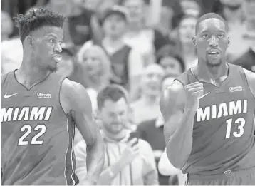  ?? MICHAEL AINSWORTH/AP ?? The Heat’s Jimmy Butler (left) and Bam Adebayo might as well start packing for Chicago and the NBA All-Star Game.