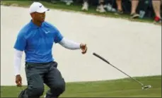  ?? CHARLIE RIEDEL — THE ASSOCIATED PRESS ?? Tiger Woods reacts after missing a birdie on the 17th hole during the third round at the Masters golf tournament Saturday, April 7, 2018, in Augusta, Ga.