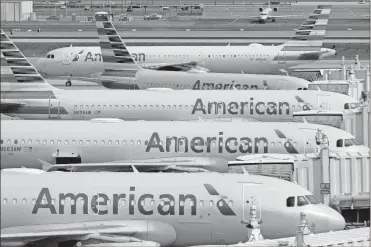  ?? AP-Matt York, File ?? American Airlines is telling 25,000 workers that they could lose their jobs in October because of the sharp drop in air travel during the virus pandemic. The airline said it was starting new offers of buyouts and partially paid leave, which it hopes will reduce the number of furloughs.