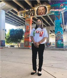  ?? ALLIANCE SAN DIEGO ?? Maria Puga, whose husband Anastasio Hernández Rojas was killed by border agents, stands in front of a mural honoring him.