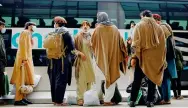  ?? Photo: Tribune News Service ?? Afghan refugees wait to take a bus in the US.