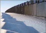  ?? Getty Images ?? The border fence between the U.S. and Mexico near New Mexico’s Highway 9.