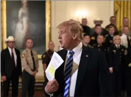  ?? ASSOCIATED PRESS ?? PRESIDENT DONALD TRUMP RESPONDS to a reporter’s question during an event with sheriffs in the East Room of the White House in Washington Wednesday.