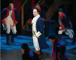  ?? Associated Press ?? ■ Lin-Manuel Miranda and the cast of "Hamilton" perform at the Tony Awards in New York. A filmed version of the original Broadway production is now available on Disney Plus.