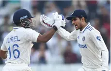  ?? Getty Images ?? India batters Shubman Gill, right, and Dhruv Jurel celebrate after beating England by five wickets in the fourth Test