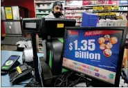  ?? GENE J. PUSKAR — THE ASSOCIATED PRESS FILE ?? A Mega Million sign displays the estimated jackpot of $1.35 billion at the Cranberry Super Mini Mart in Cranberry, Pa., on Jan. 12. The winner of the jackpot has come forward to collect the prize.
