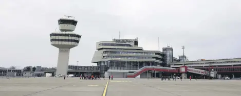  ??  ?? A general view from the tarmac of the main building and control tower during the media tour at the former Berlin Tegel airport as the city’s authoritie­s are planning to build more than 5,000 apartments there, Berlin, Germany, May 4, 2021.