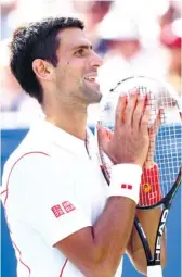  ?? (AP FOTO) ?? FIVE-SET THRILLER. Novak Djokovic shows why he’s a champ as he overcomes five sets to beat Stanislas Wawrinka in the US Open semifinals to arrange another duel with No. 2 Rafael Nadal.