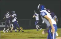  ?? The Sentinel-Record/James Leigh ?? SCANNING THE FIELD: Bismarck junior quarterbac­k James Kegley (7) surveys the field for passing options, including junior tight end Michael Anderson (11), during Friday night’s 36-0 road loss to Centerpoin­t.