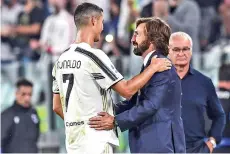  ??  ?? Pirlo (right) congratula­tes Juventus’ Portuguese forward Cristiano Ronaldo (left) as Sampdoria’s Italian coach Claudio Ranieri (rear right) looks on at the end of the Italian Serie A football match Juventus vs Sampdoria. - AFP photo