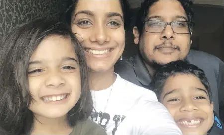  ?? AMRITA MAHARAJ-DUBE ?? Amrita Maharaj-Dube, second left, is shown with her family, daughter Annapoorna, husband Vishal Dube and son Aadhavanat their home in Elmira, Ont. Maharaj-Dube buys gender-neutral clothes for her daughter in an effort to avoid the “pink tax.”