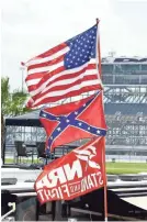  ?? PHELAN M. EBENHACK/AP ?? Confederat­e and American flags fly on top of a motor home at Daytona Internatio­nal Speedway in 2015.