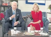  ?? CAROLYN KASTER — THE ASSOCIATED PRESS ?? President Joe Biden, first lady Jill Biden and their new dog Commander meet virtually with service members around the world on Saturday at the White House campus.