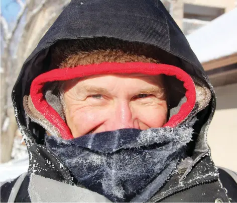  ?? MORGAN MODJESKI ?? Ice forms on Ron Bestvater’s scarf and hood as he walks home along Victoria Street on Thursday. Much of Saskatchew­an remains under an extreme cold warning with temperatur­es falling to -39 C on Thursday morning. Friday’s forecast calls for more chilly Arctic conditions.