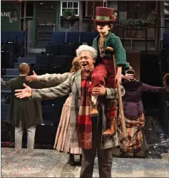  ?? Photo by Mark Turek. ?? Joe Wilson Jr. stars as Ebenezer Scrooge and Joshua Pacheco as Tiny Tim in this year’s Trinity Rep production of ‘A Christmas Carol,’ directed by Angela Brazil and Stephen Thorne.