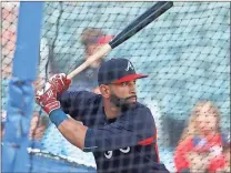  ?? John Bazemore / AP ?? Atlanta’s Jose Bautista takes batting practice before making his first start with the team after being called up from Triple-A Gwinnett.