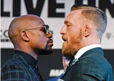  ?? AFP ?? Floyd Mayweather und Conor McGregor geben sich Saures.